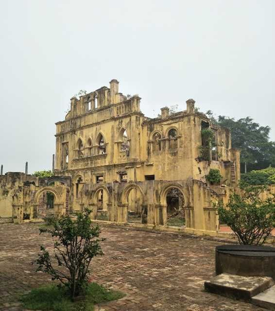 The ruined yellow house beside the castle